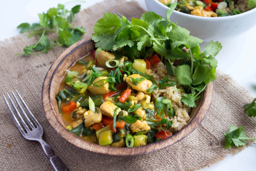 coconut chicken curry in a wooden bowl