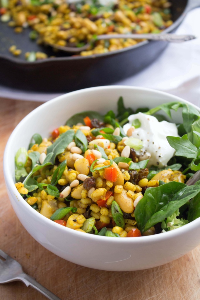 Close up of Spiced Raisin and Pine Nut Barley Salad in a bowl