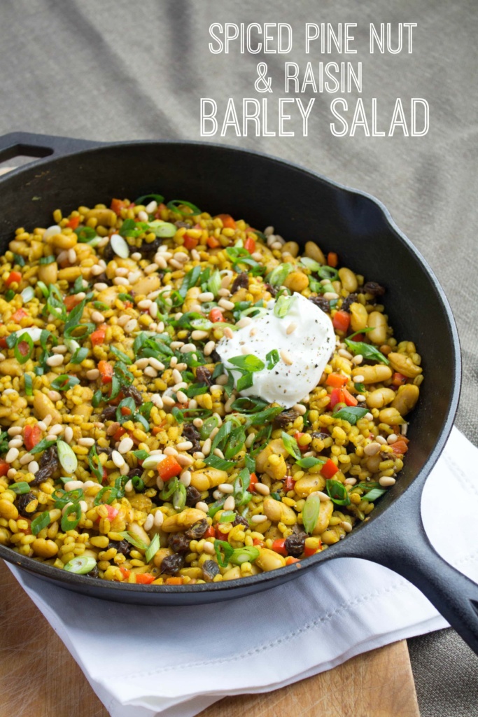 spiced barley salad with pine nuts in a cast iron skillet