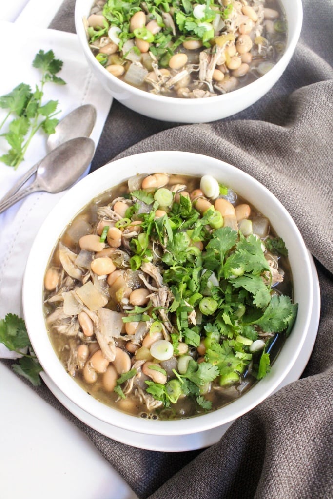 This Chicken White Bean Chili Soup is easy and so flavorful. Using rotisserie chicken is a great shortcut for weeknight dinners & makes this recipe super quick!