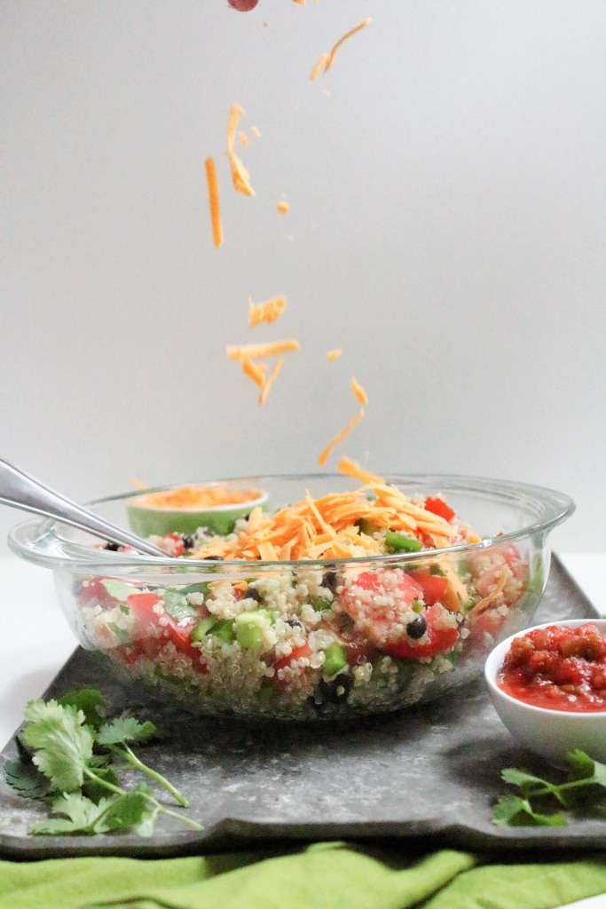 quinoa salad with cheese and salsa in a bowl