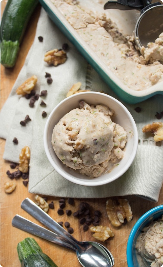 zucchini bread almond milk ice cream in a small white bowl with chocolate chips and walnuts