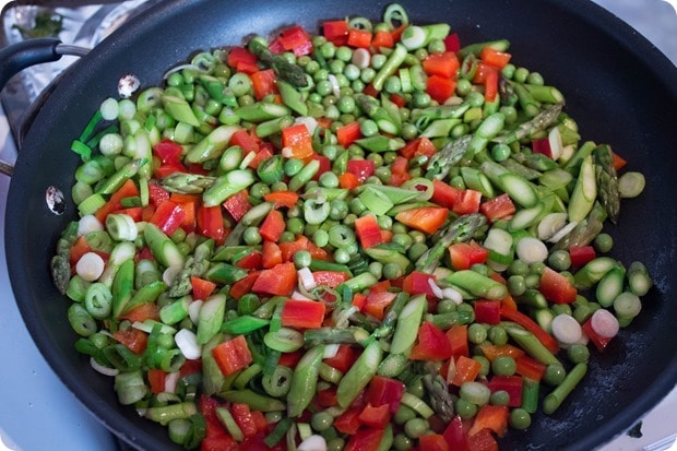 cooking spring vegetables in a skillet