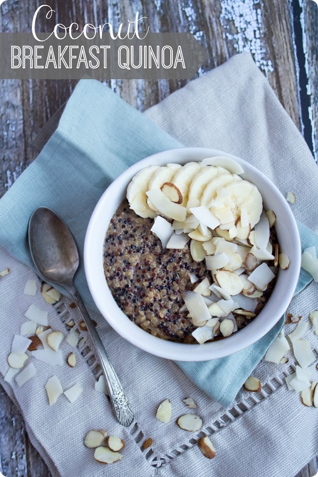 breakfast quinoa bowl with coconut, banana slices, and sliced almonds on a beige linen napkin
