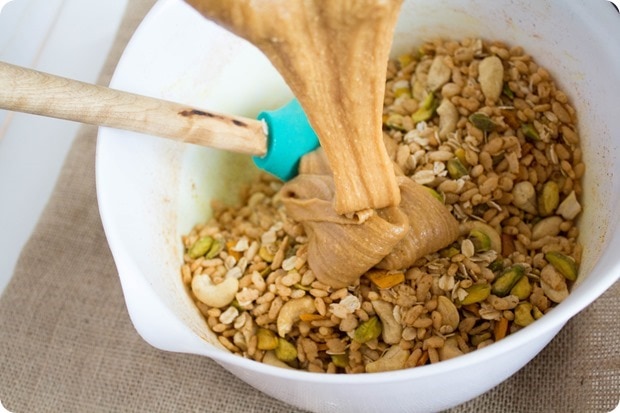 how to make savory granola bars 2 pouring peanut butter wet mixture into dry granola bar mixture