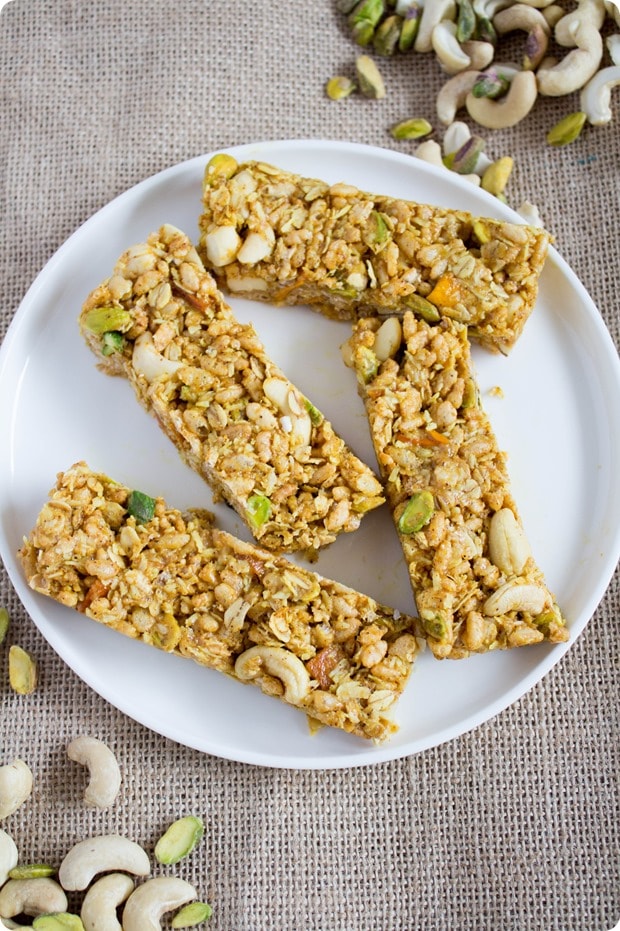 savory curry granola bar recipe 2 savory curry granola bars made with puffed rice on a white plate