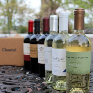 blue apron wine lined up on a table.