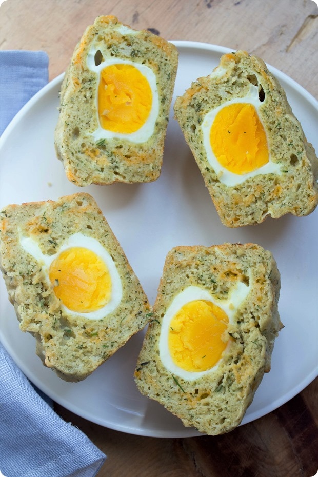savory gluten free muffins gluten free egg and cheddar muffins cut in half on a plate