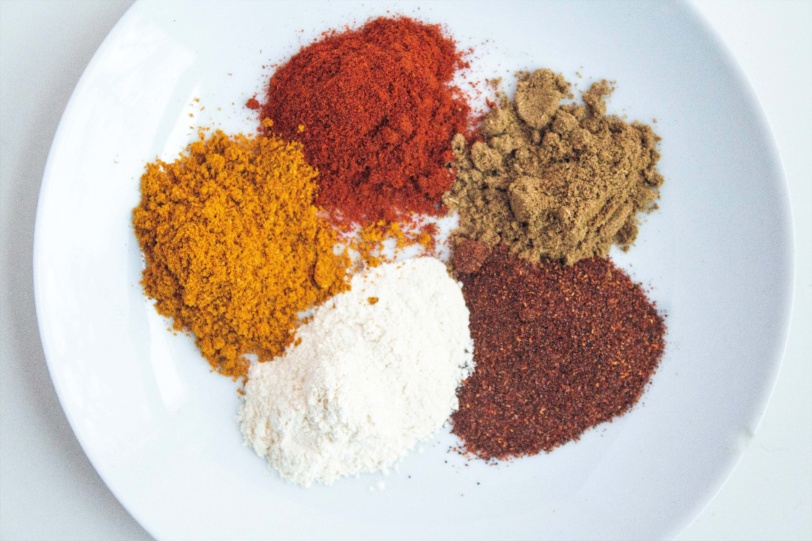 A bowl of various spices as pantry staples for flavoring food
