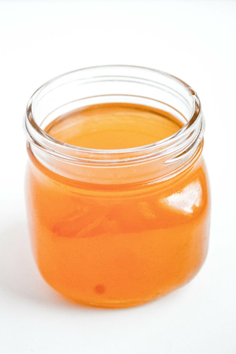 pantry staples of vegetable and chicken broth in a jar