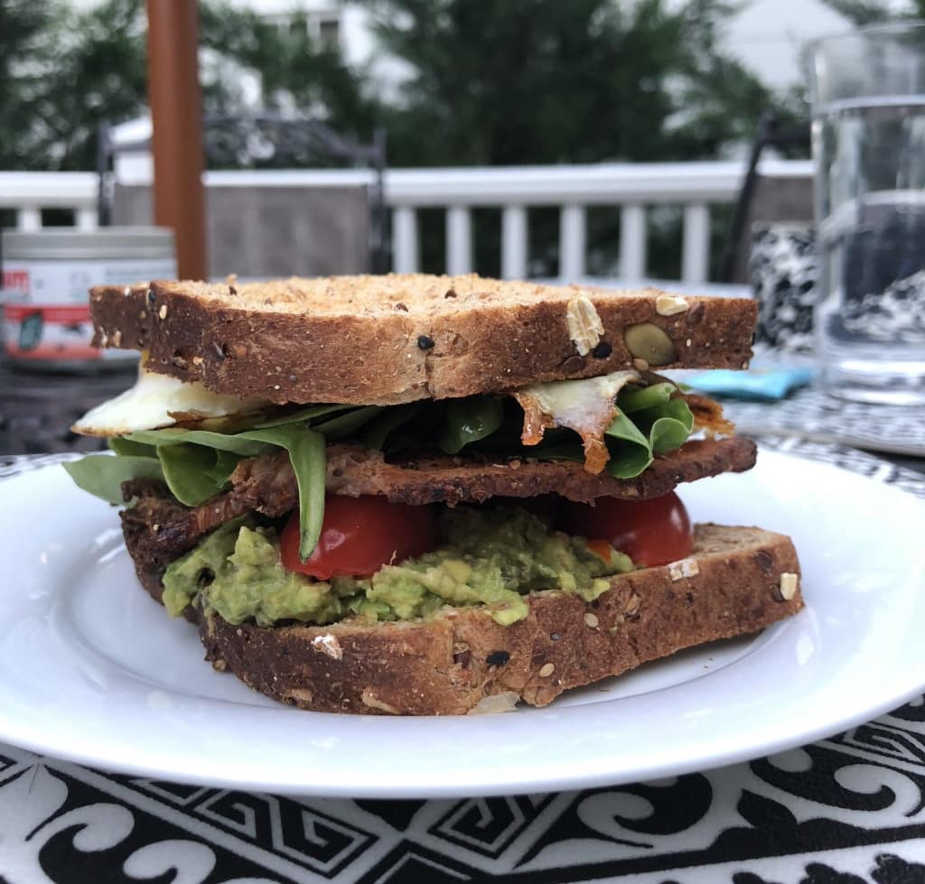 bacon lettuce tomato egg avocado cheese sandwich