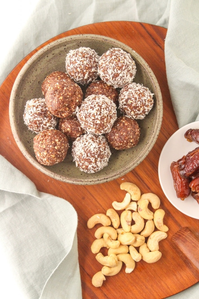 no bake energy balls with dates, coconut, cashews, and cocoa powder