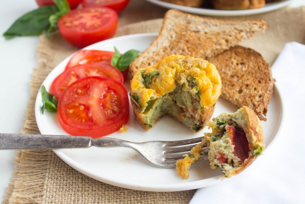 healthy meal prep breakfast - toast, eggs, and tomatoes on a plate