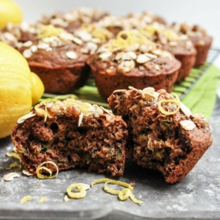 vegan zucchini muffins with lemon zest and oats on top