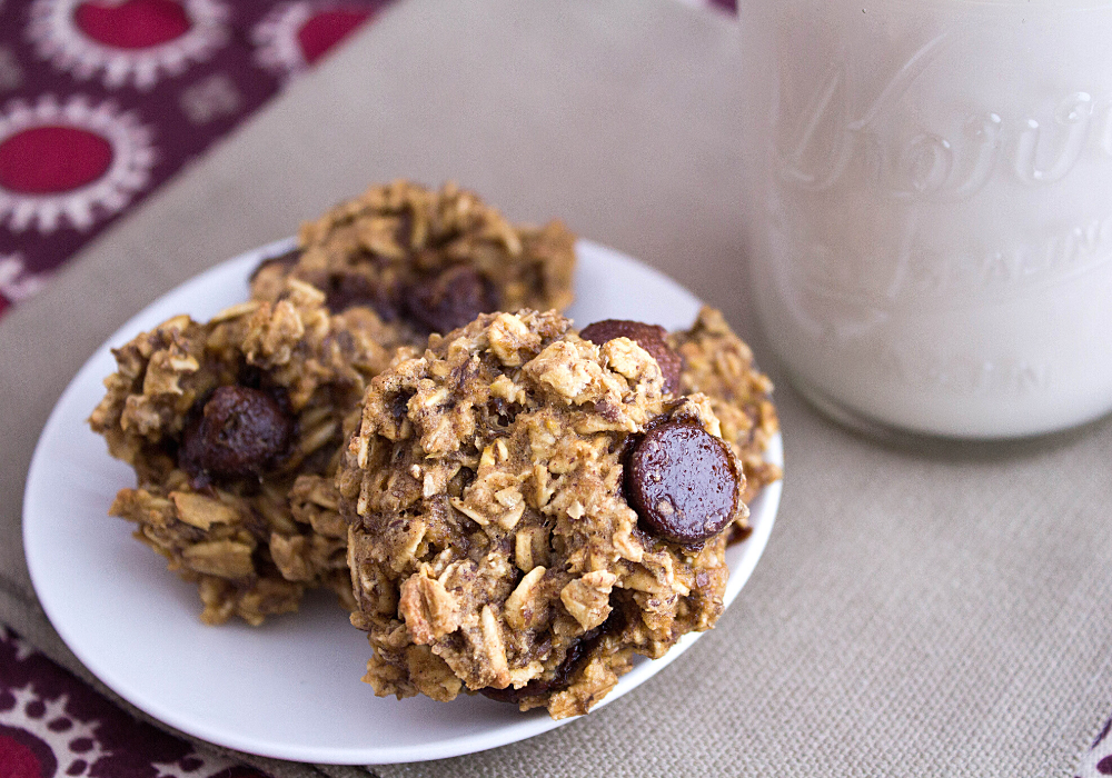 plate of oatmeal chocolate chip cookies with milk