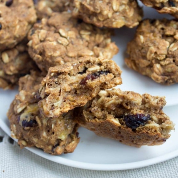 vegan pumpkin oatmeal cookies cut in half on a plate