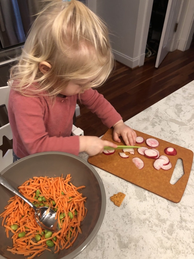 toddler slicing veggies