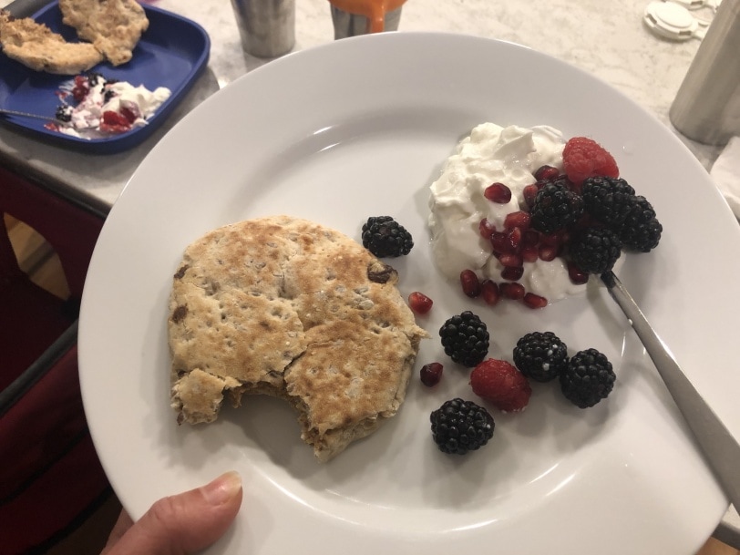 meusli round with nut butter and yogurt with berries