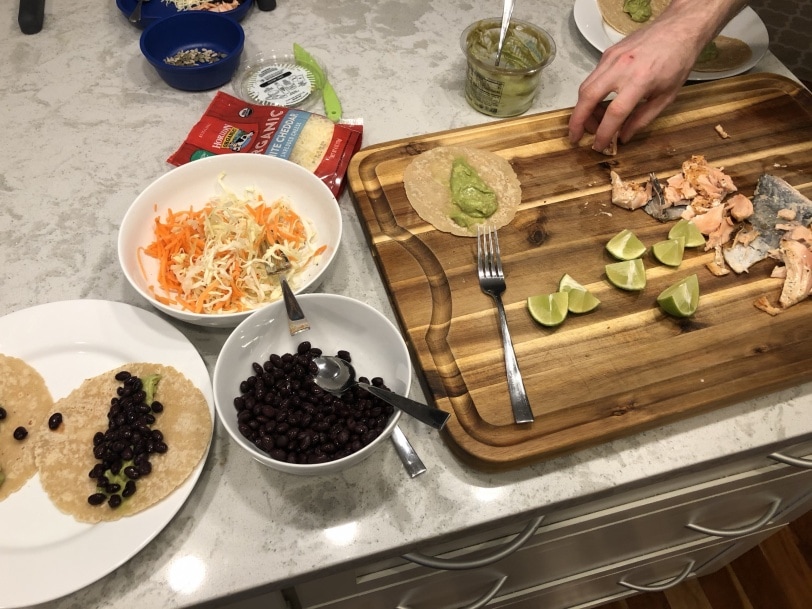 making salmon tacos for dinner