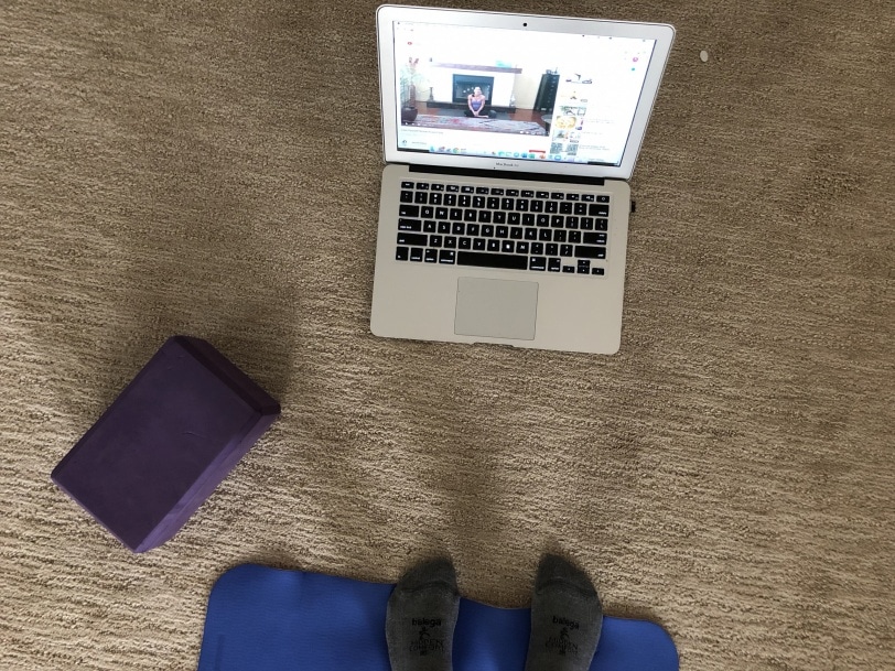 doing yoga at home via youtube video