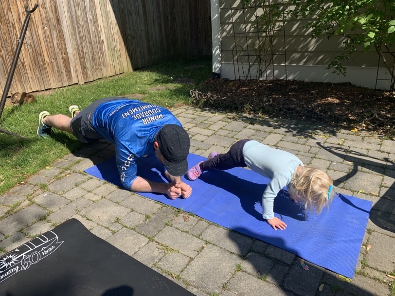 toddler exercising with dad