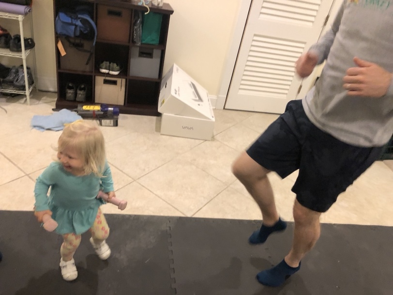 toddler exercising with dad