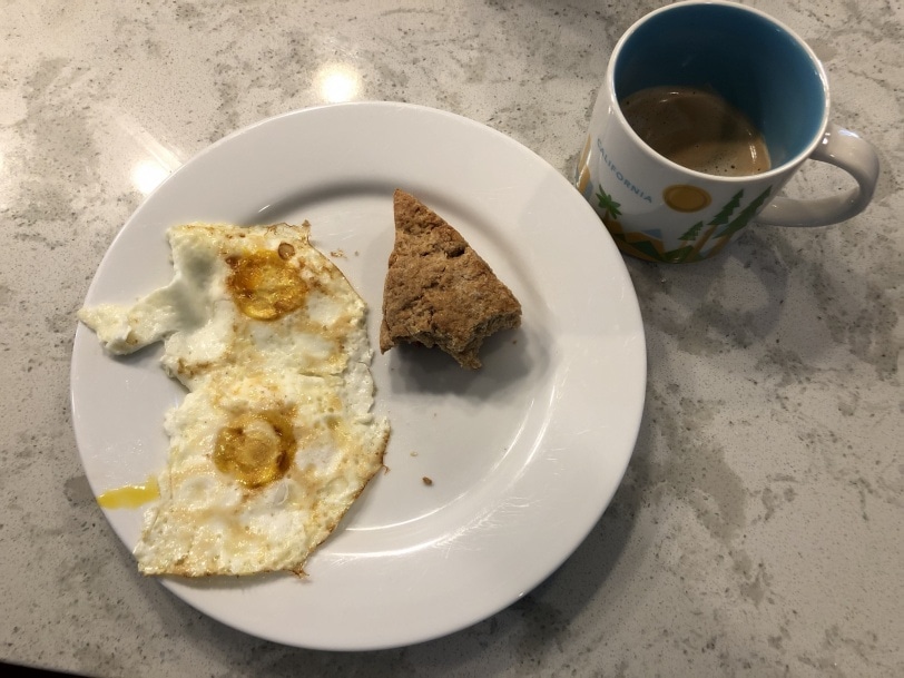 leftover strawberry scone with two fried eggs