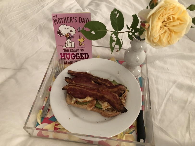 breakfast in bed - avocado toast with bacon and eggs