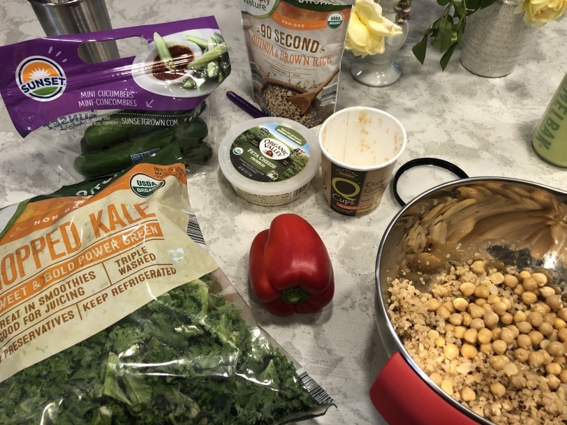 ingredients laid out to make a mediterranean quinoa salad