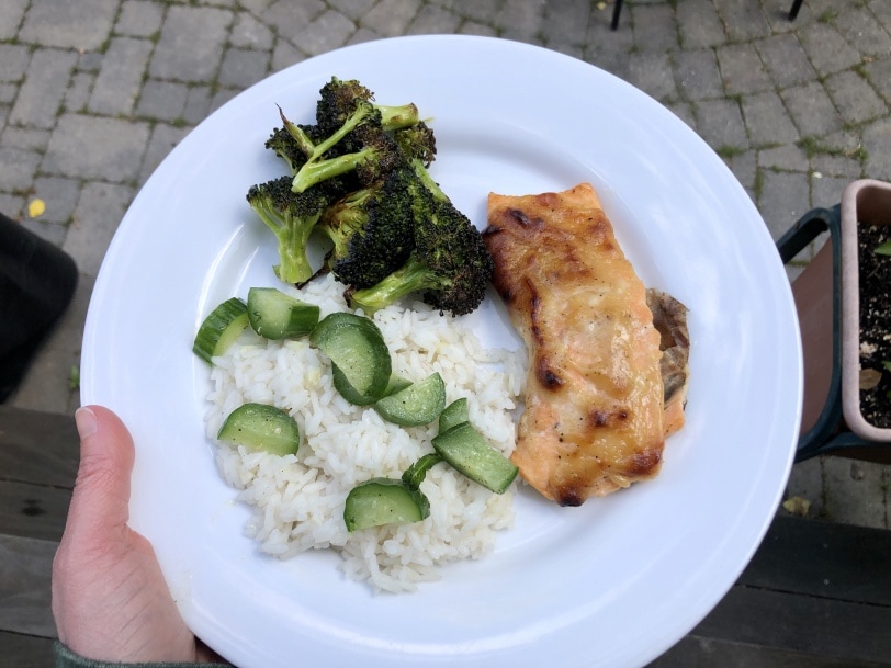 Asian salmon with pickled cucumber, roasted broccoli, and rice