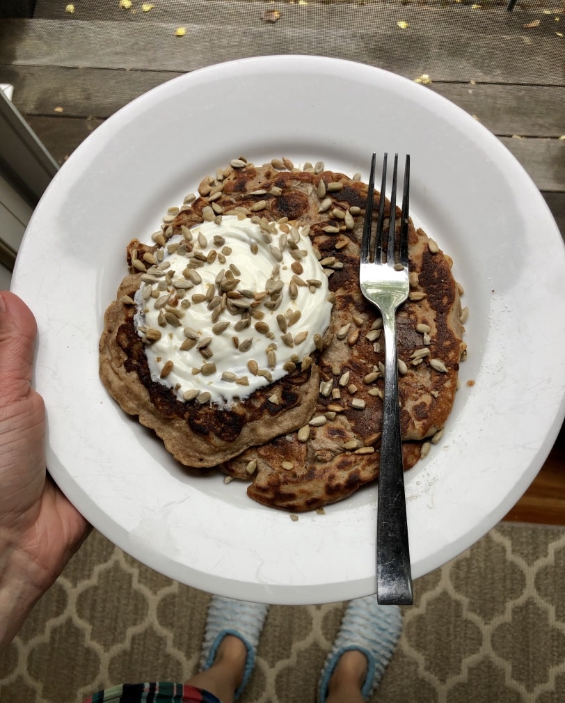 pancake topped with yogurt and seeds