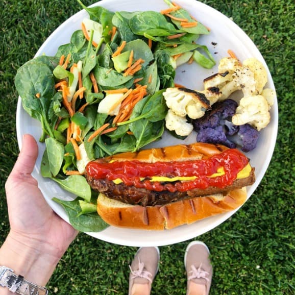 grilled dinner of sausage salad and cauliflower