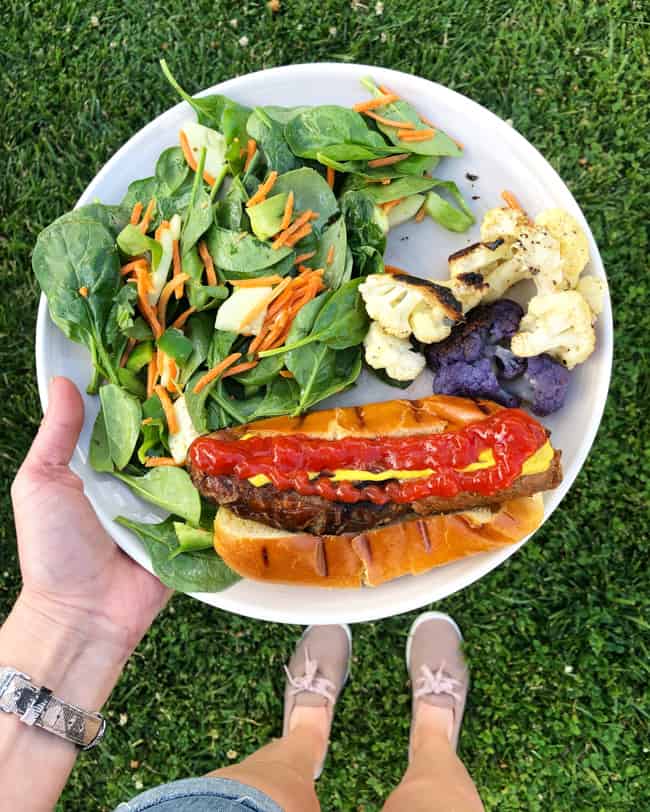 grilled dinner of sausage salad and cauliflower