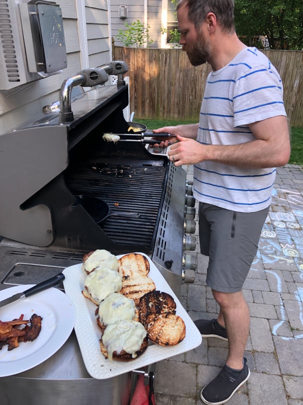 making cheeseburgers on the grill