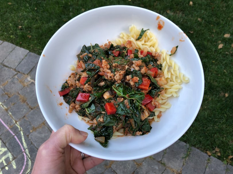 pasta topped with veggie and sausage bolognese