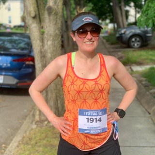 runner in an orange tank top
