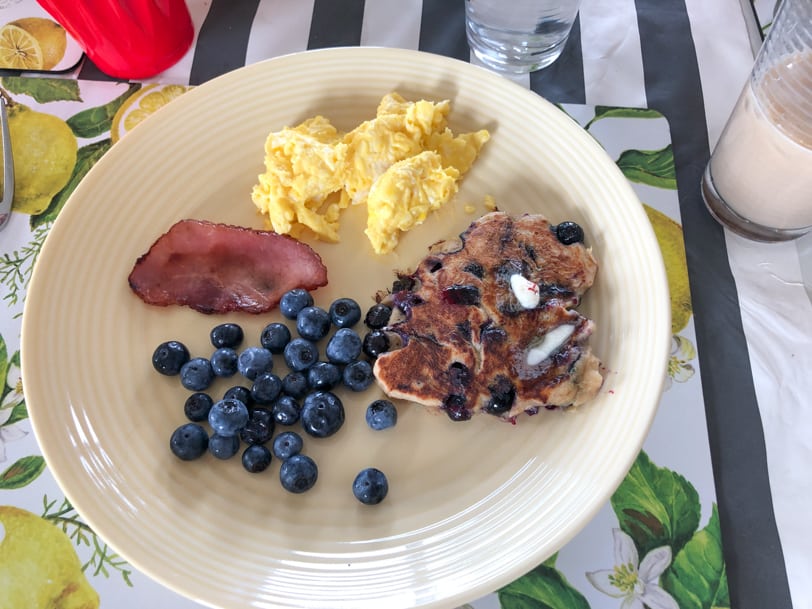 sourdough pancakes with blueberries bacon and scrambled eggs