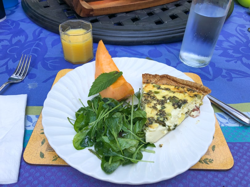 quiche and salad with cantaloupe