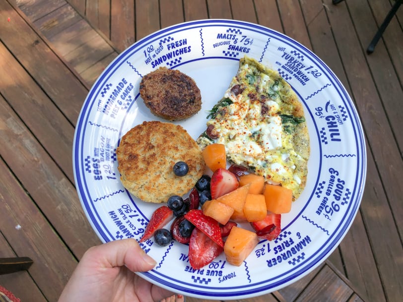 greek frittata with sausage, english muffin, and fruit