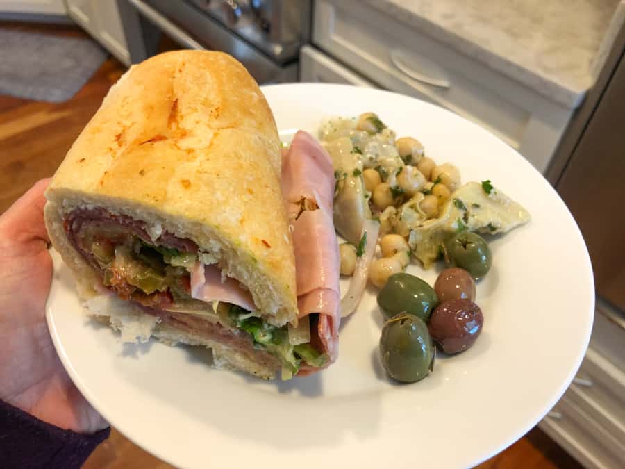 italian sub with chickpea and artichoke salad and olives