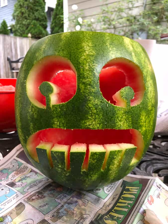 watermelon carved into a face with big teeth
