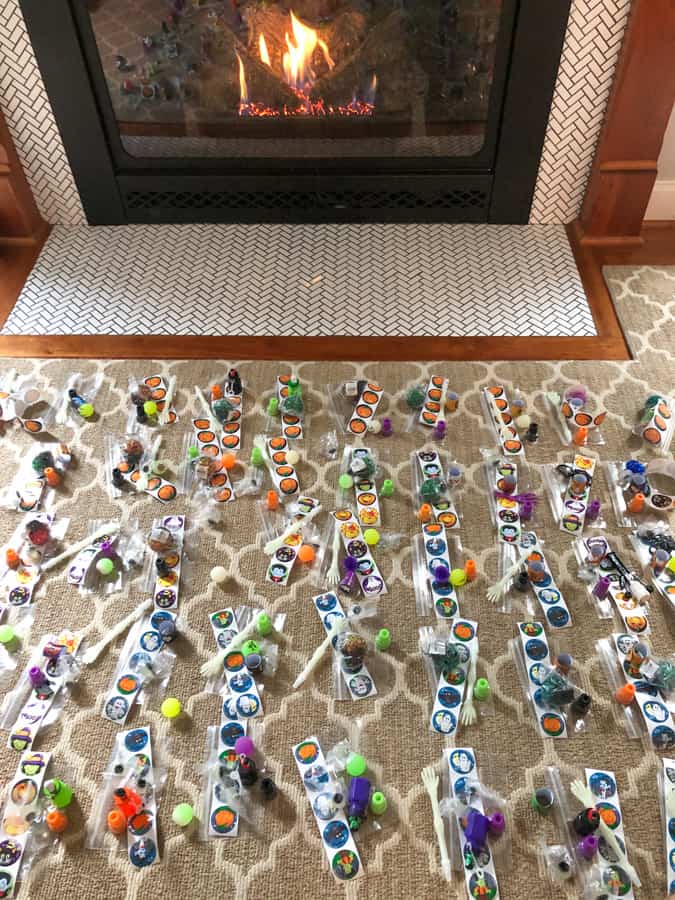 making bags of toys and candy for halloween