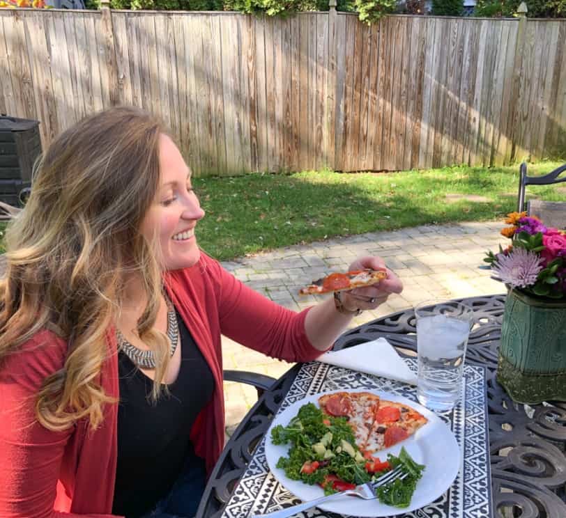enjoying pizza and kale salad