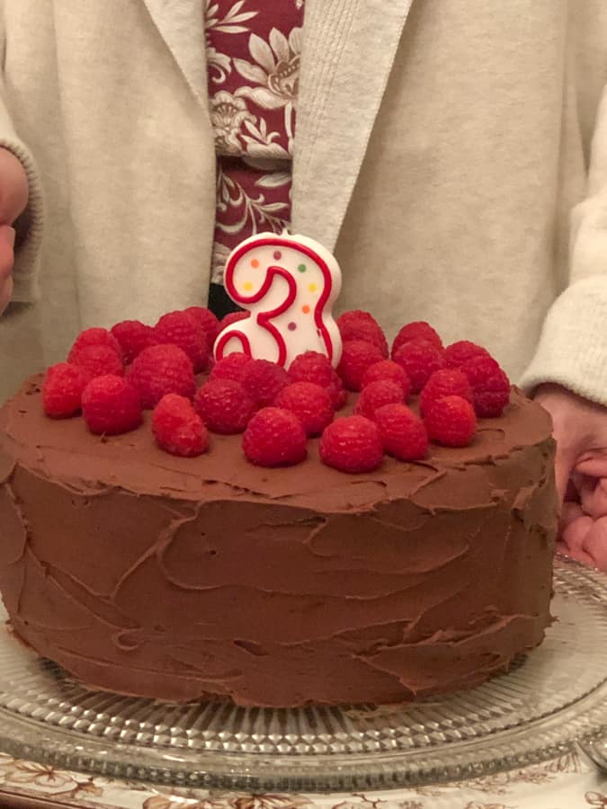 3 year old chocolate birthday cake with raspberries