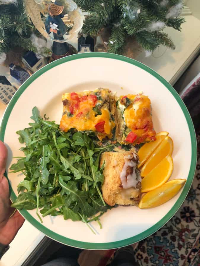 christmas brunch - sausage egg casserole, arugula, oranges, cinnamon roll