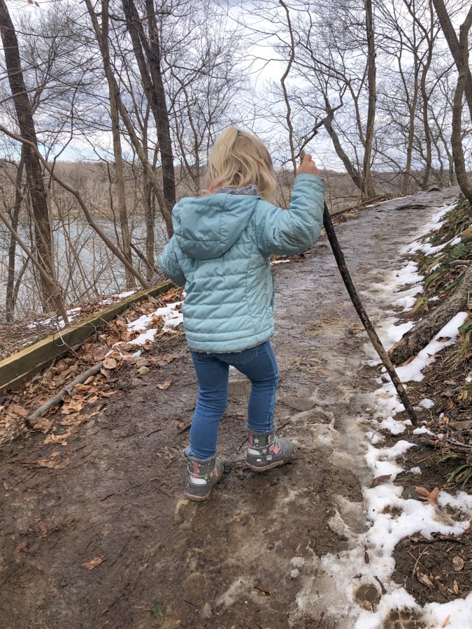 toddler hiking up a hill