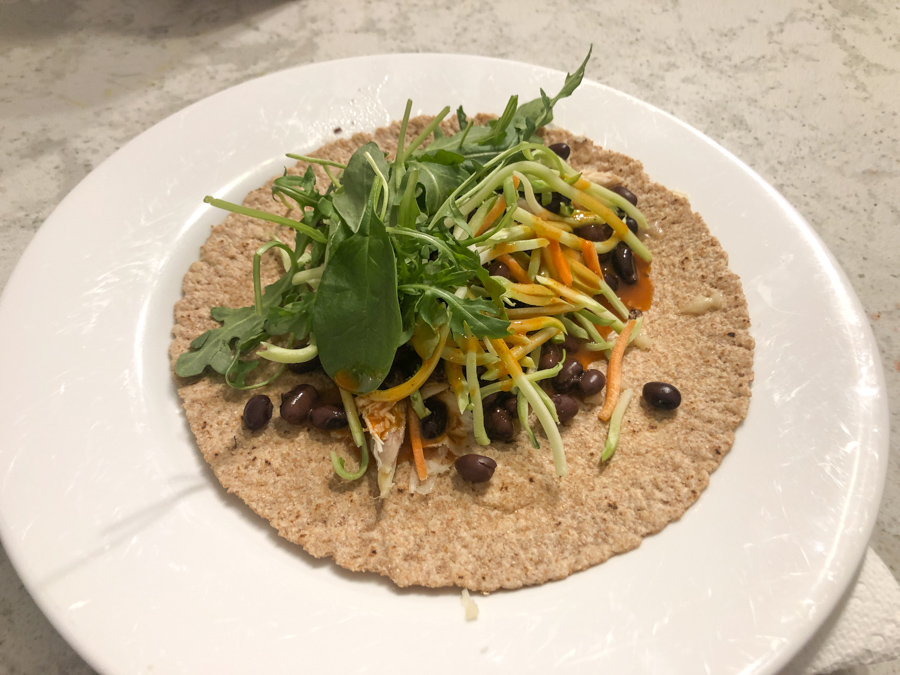 chicken wrap with black beans, broccoli slaw, arugula