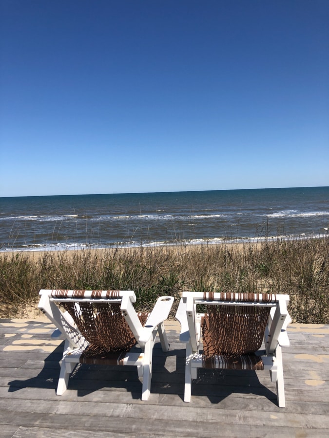chairs with a view of the ocean at the sanderling resort