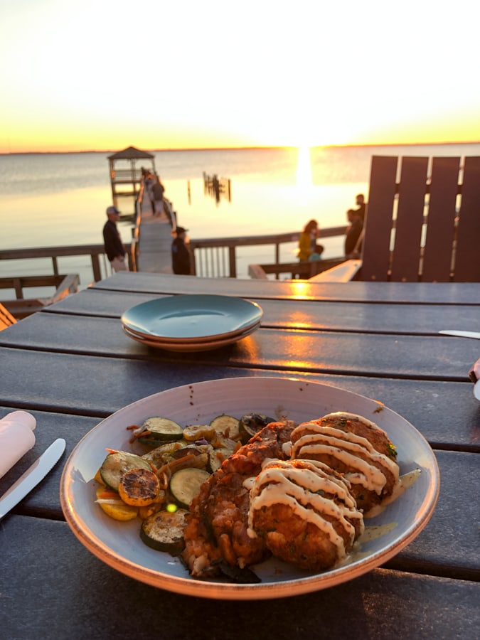 crab cakes with a sunset view at NC coast restaurant in Duck