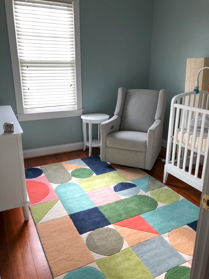 baby boy room with colorful rug